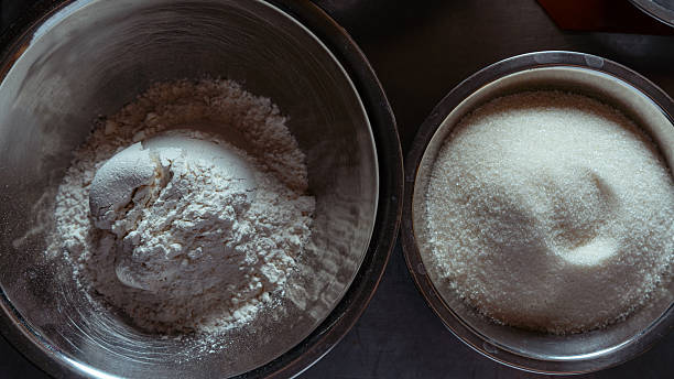 Baking ingredients with flour and sugar in bowls