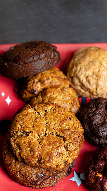 Assorted fresh baked cookies on red plate