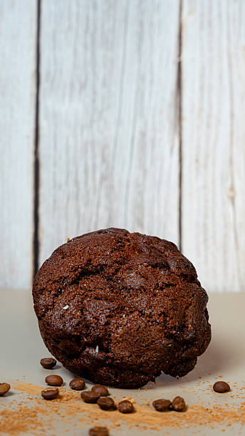 Decadent chocolate muffin with coffee beans and cinnamon