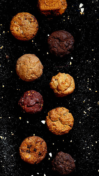 Assortment of gourmet cookies and biscuits on dark background