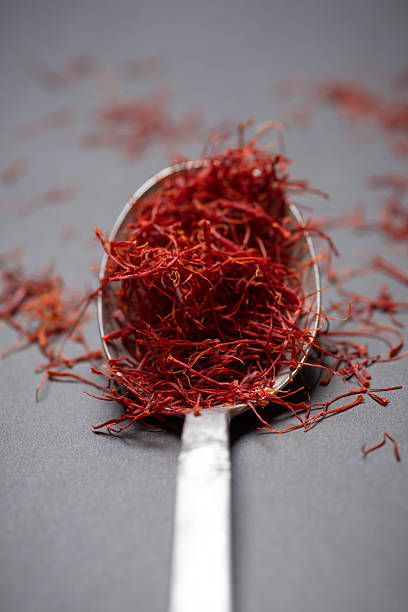 Premium Red Saffron Spice on Silver Spoon