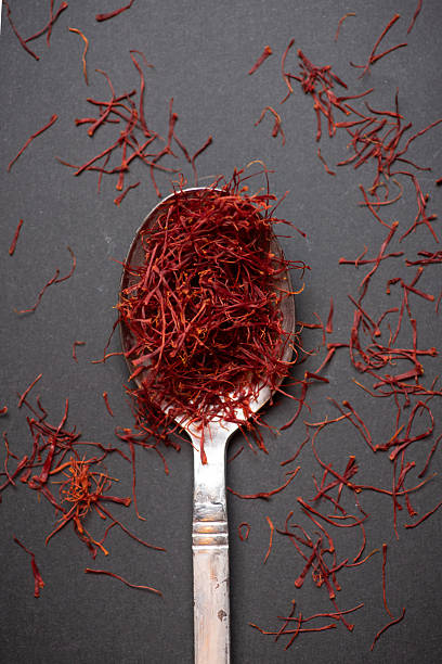 Premium Red Saffron Spice on Silver Spoon