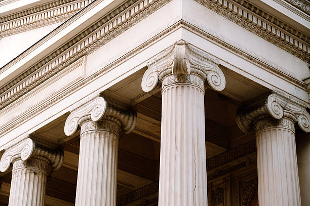 Close-up of ornate classical columns and facade details. Historic architecture and design concept.