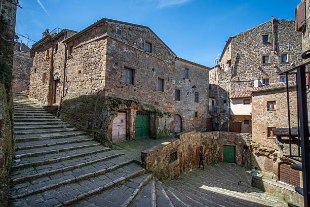 Pitigliano, Tuscany, Italy - April 6: Pitigliano is a town of 3,513 inhabitants in the province of Grosseto in Tuscany. Pitigliano's stairways are an integral part of the labyrinthine historic center, characterized by narrow ramps, winding alleys, and tuff houses perched high on the cliff.