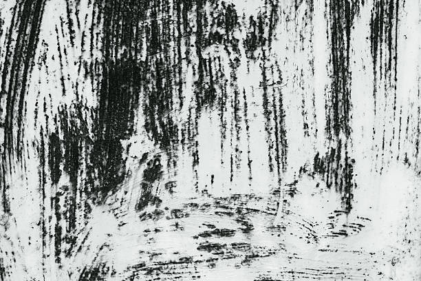 Old black and white grunge texture background with stains scratches and dust