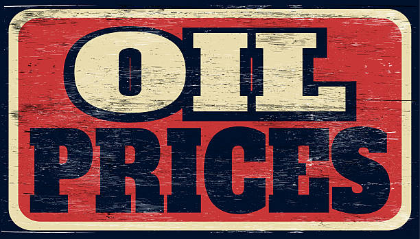 Aged and worn oil prices sign on wood