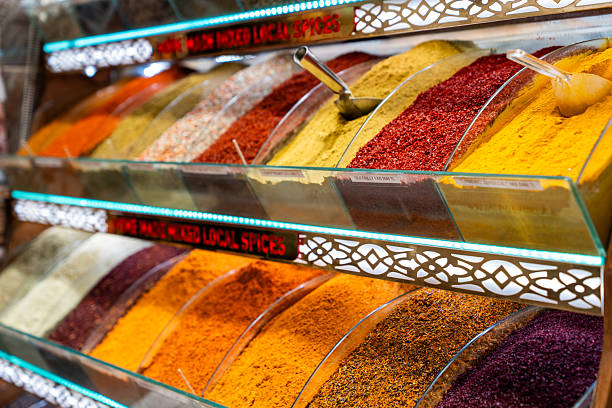 Colorful Spice Varieties in Glass Display Cases with Aromatic Herbs and Powders at the Historic Grand Bazaar Market in Istanbul
