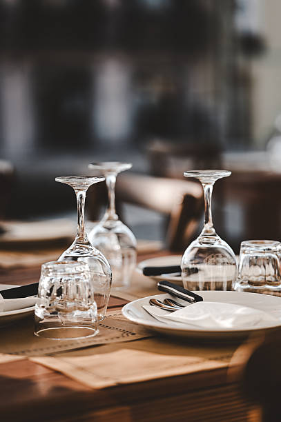 Restaurant table setting with wine glasses ready for dining Restaurant table setting with wine glasses ready for dining
