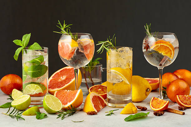 Refreshing summer drinks with ingredients on a white marble table. stock photo