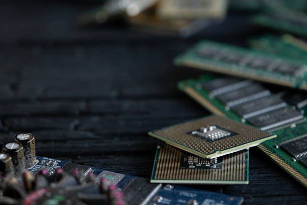 Computer memory modules and processors close up Detailed view of RAM memory sticks and processor chips on dark background. improve memory stock pictures, royalty-free photos & images