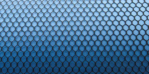 Photo of Black hexagonal patterned mesh texture background on a gradient blue surface