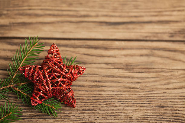 istock Red Christmas star on old wooden plank 450014437