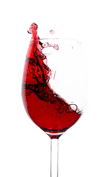 istock Splashing red wine in a glass 450023405