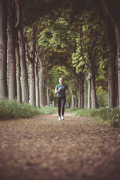 istock Marathon run in the autumn forest 450025725
