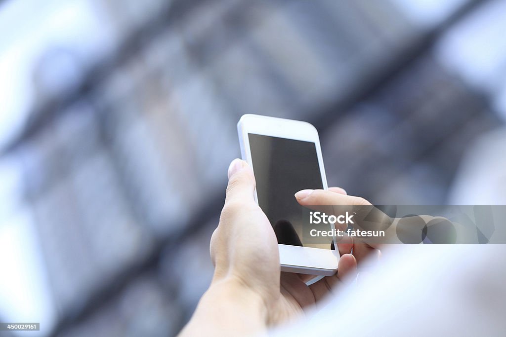 Toucher le téléphone intelligent - Photo de Abstrait libre de droits