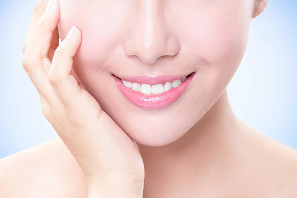 istock Beautiful young woman teeth close up 450029375