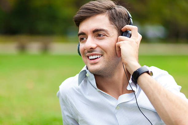 istock Young man listening to music 450032775