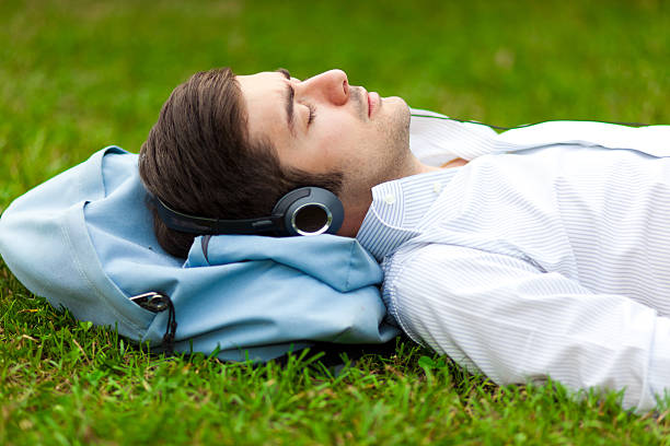 istock Young man listening to music 450033347