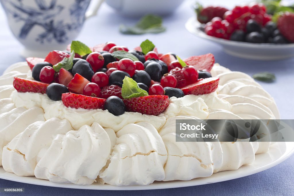Cake "Pavlova" with cream and berries. Afternoon Tea Stock Photo