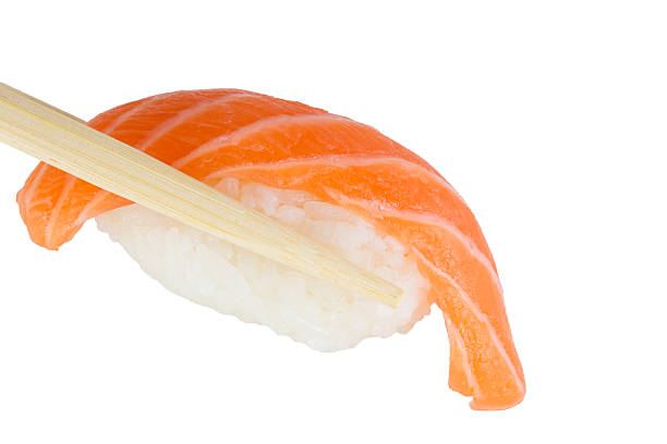istock isolated salmon sushi nigiri in chopsticks on white background 450037029