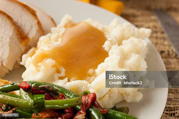 Mash Potato And Gravy With Green Beans And Turkey Slices Stock Photo - Download Image Now