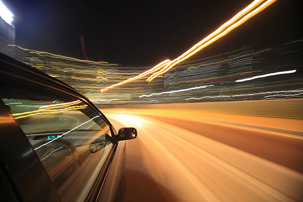 istock Night drive with car in motion. 450043027