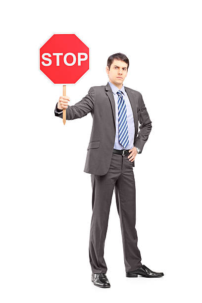 istock Businessman holding a stop sign 450056753