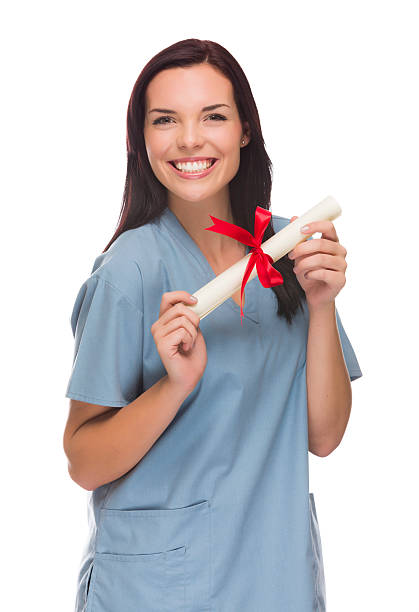 razza mista femmina medico o l'infermiere con diploma indossa scrub - spanish culture women latin american and hispanic ethnicity mexican culture foto e immagini stock