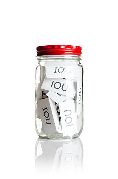 IOU’s in a jar stock photo