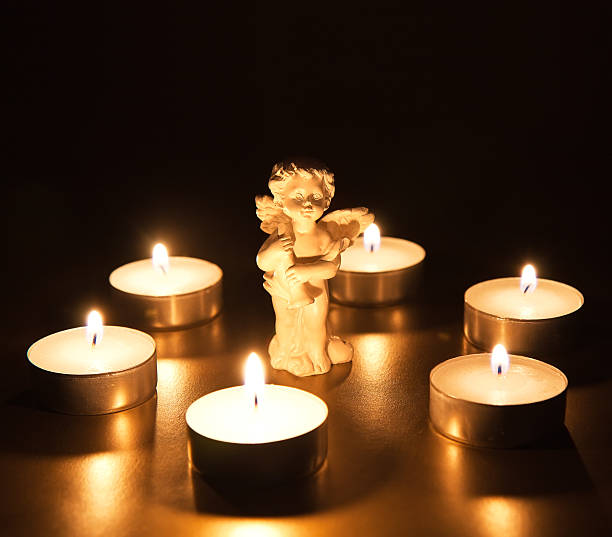 istock Christmas angel with candles 450061905