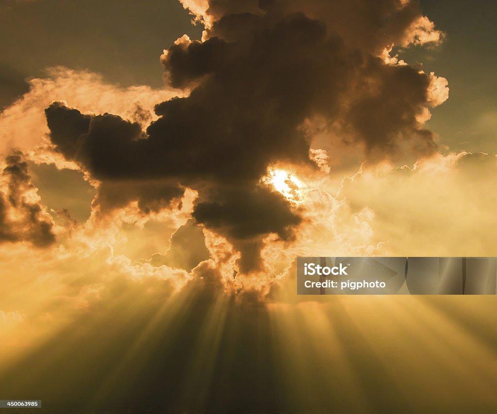 Rays of light shining through dark clouds city Bangkok, Thailand Abstract Stock Photo