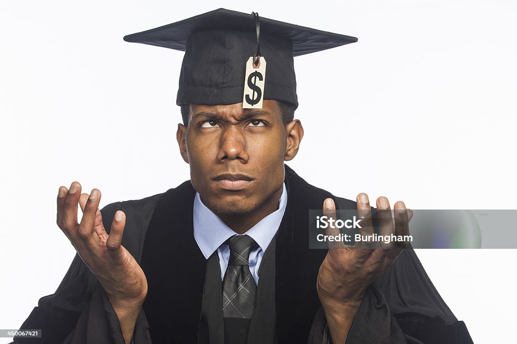 College graduate looking at his tuition price tag, horizontal African American college graduate looking at his high tuition price tag Student Debt Stock Photo