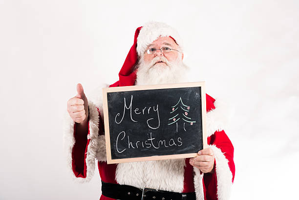 istock Santa Claus holds a blackboard and thumb up 450070193