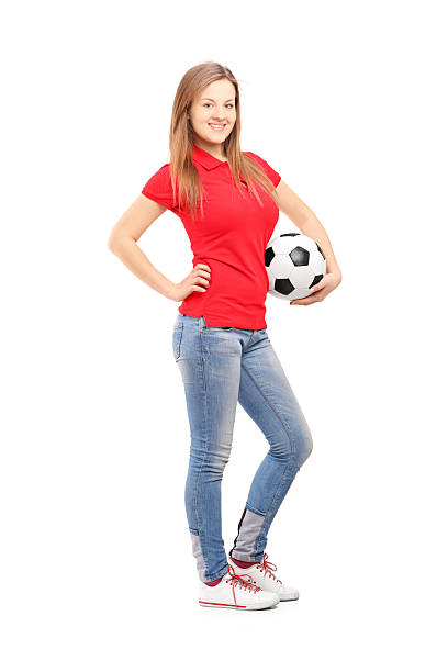 istock Young smiling female holding a soccer ball 450071095