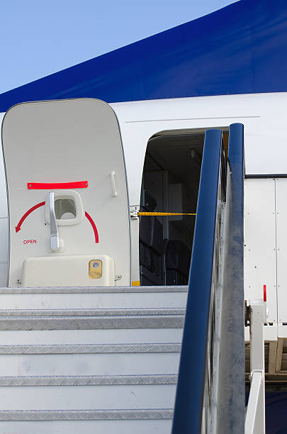 istock Passenger boarding stairs with open door 450071245