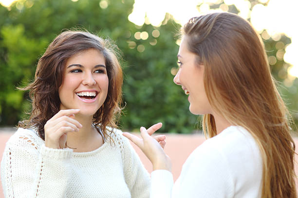 istock Two young women talking outdoor 450074353
