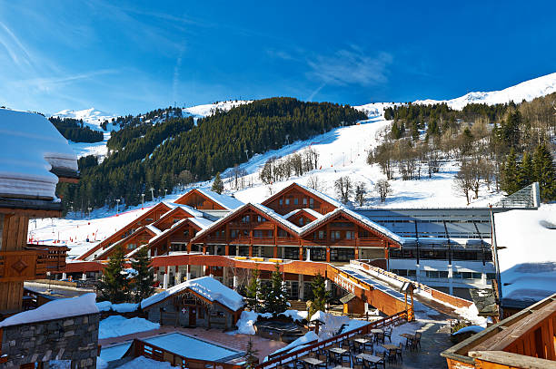 A ski resort in the snowy mountains  Mountain ski resort with snow in winter, Meribel, Alps, France courchevel stock pictures, royalty-free photos & images