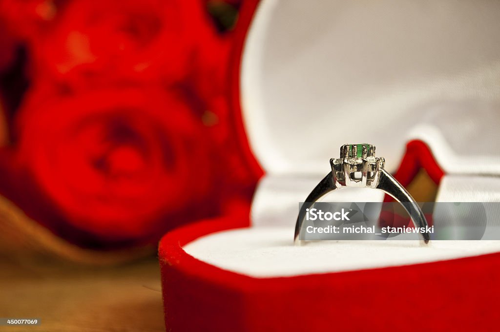 Engagement coposition - ring and roses on wooden surface Beauty Stock Photo