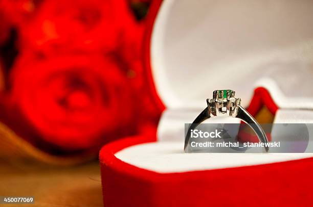Engagement Coposition Ring And Roses On Wooden Surface Stock Photo - Download Image Now