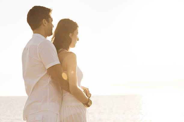 istock young couple by the sea 450087825