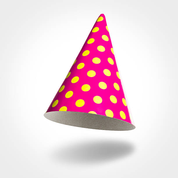 Pink party hat in air, yellow spots isolated on white stock photo