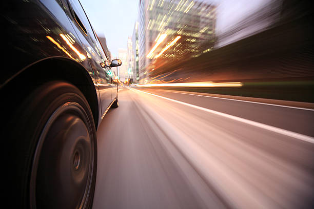 istock Driving in the sunset city 450113225