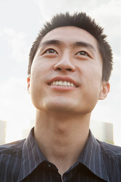 istock Portrait of young man looking up, Beijing 450115579