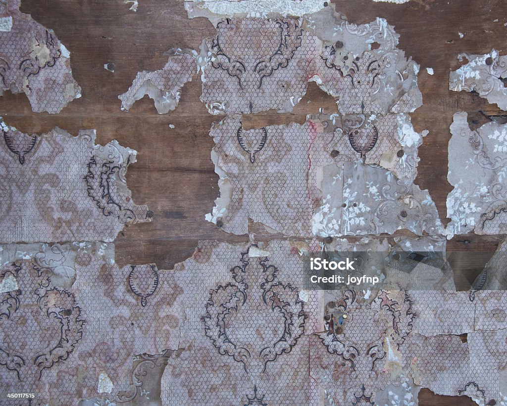 Peeling Wallpaper Texture Old wallpaper peels from the walls of historic house Abstract Stock Photo
