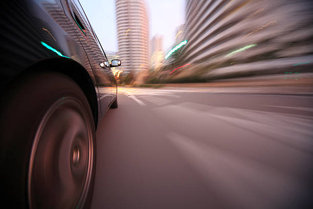 istock Driving in the sunset city 450117627