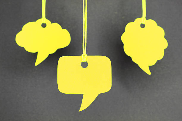 istock Speech bubbles hanging in yellow color 450117787