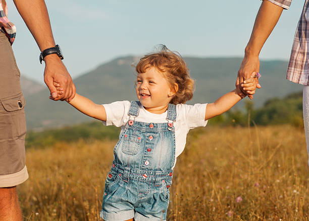 istock Happy mother and father with daugther 450121901
