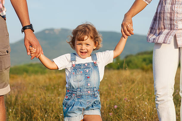 istock Happy mother and father with daugther 450124071