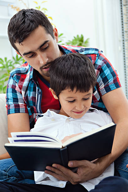 istock Father and son at home 450130985