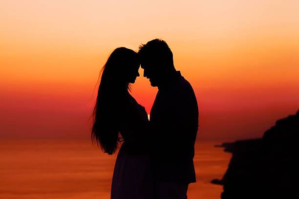 istock silhouette couple in love 450136731